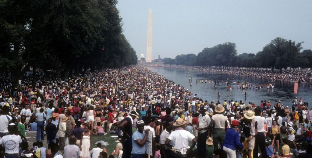 Crowd comes together to honor the legacy of Dr. King and the civil rights movement at the 1983 20th anniversary March on Washington. Photographed by Dr. McKinney and family.