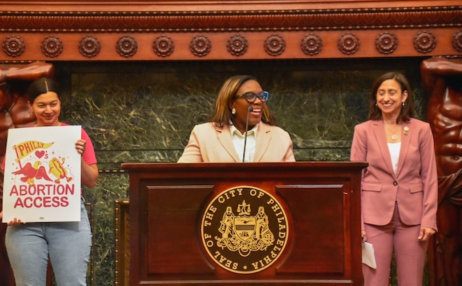 Councilmembers Kendra Brooks (center) and Rue Landau advocate for funding for abortion access in City Hall.